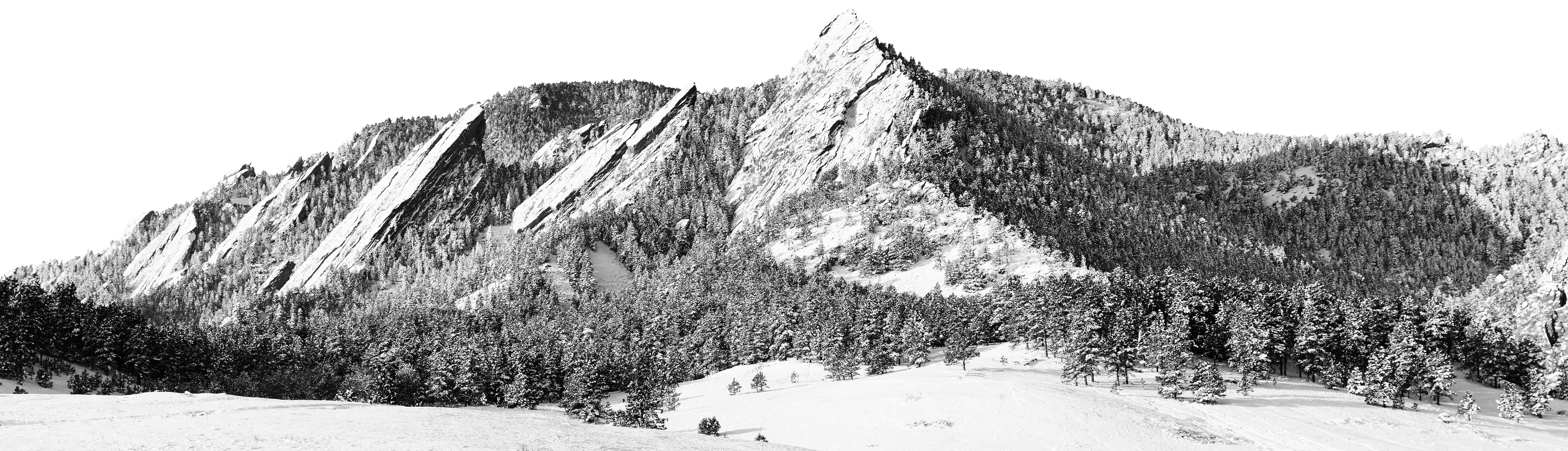 Black and white photo of the Flatiron rock formation in winter